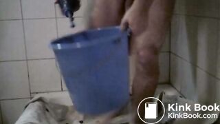 chubby gay guy smearing poop from a tub