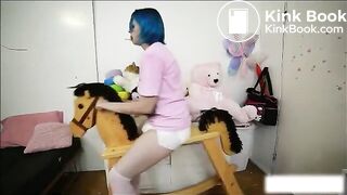 Diaper girl poops on her rocking horse