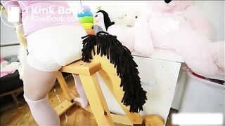Diaper girl poops on her rocking horse