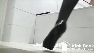 Pooping woman in black stockings