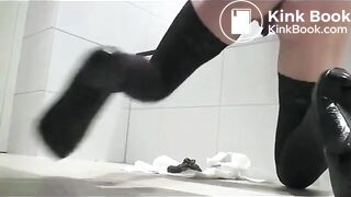 Pooping woman in black stockings