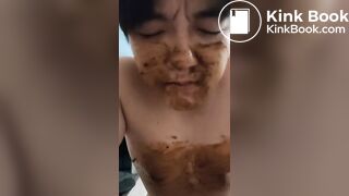 asian pulls shit from toilet and smears eats