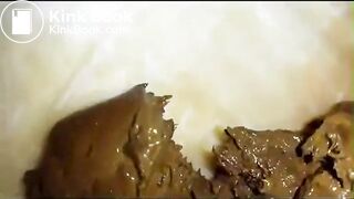 Golden fingertips covered in shit