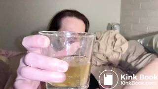Madelin drinking her piss enema