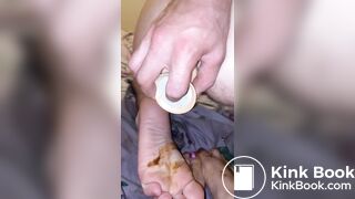 Guy smearing his shit on girlfriend feet