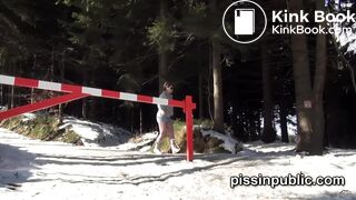 Girls in need skate around in the snow to find a proper place to have a pee