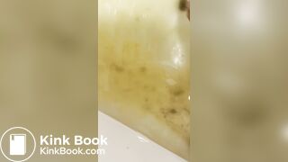 Smelly gal scoops her poop from the shower water