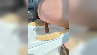 A plump buttock defecating on the toilet.