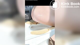 A plump buttock defecating on the toilet.