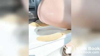 A plump buttock defecating on the toilet.