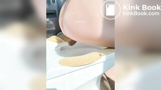 A plump buttock defecating on the toilet.