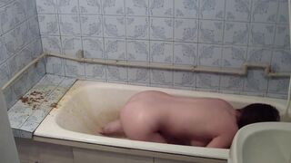 Girl take enema in bathroom