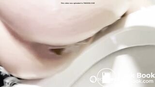 Girls pauses a shower to take a poop