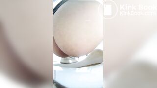 Chinese girl defecating and urinating in the toilet.