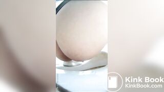 Chinese girl defecating and urinating in the toilet.