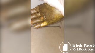 Girl puts hand into dirty glove