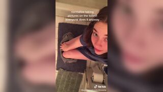 Casual girl does toilet selfie