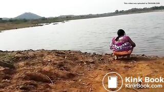 Pissing at the river bank india