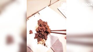 Chinese girl plays with her shit with chopsticks