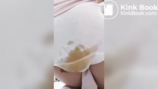 Chinese girl has an enema and poop herself