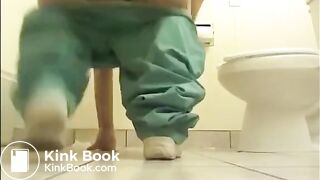 NURSE SHITTING ON THE FLOOR OF A HOSPITAL TOILET