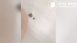 Girl makes mess in bath.