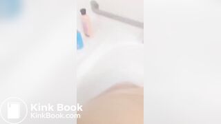 Girl makes mess in bath.