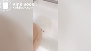 Girl makes mess in bath.