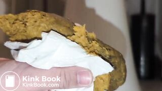 shitting out a big turd onto the floor