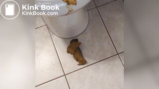 shitting out a big turd onto the floor
