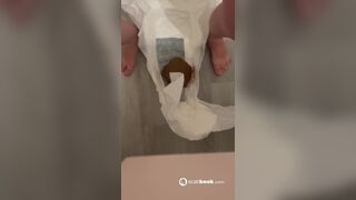 She take off her filled poopy diaper