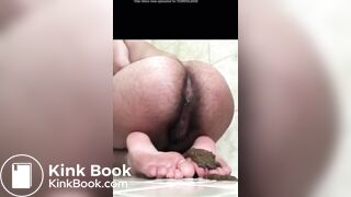 Hairy Ebony babe covers her feet in a puddle of poop