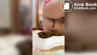 Pissing and pushing out a huge shit