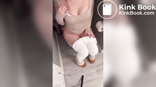 Sexy girl in white leggings having diarrhea on toilet