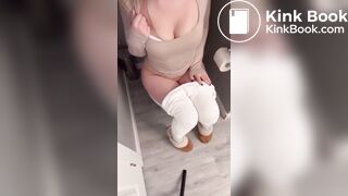 Sexy girl in white leggings having diarrhea on toilet