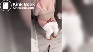 Sexy girl in white leggings having diarrhea on toilet