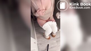 Sexy girl in white leggings having diarrhea on toilet