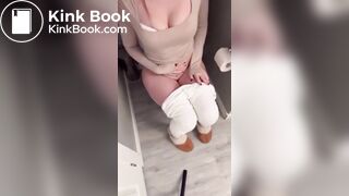 Sexy girl in white leggings having diarrhea on toilet