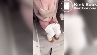 Sexy girl in white leggings having diarrhea on toilet