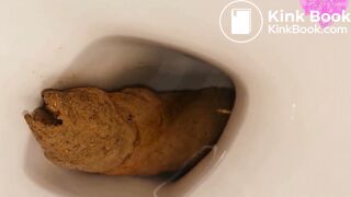 Girl does a massive log that clogs the toilet