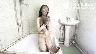 Little asian girl covers herself with a lot of shit