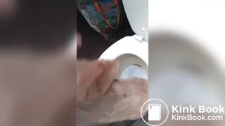 Girl shits a messy pile on the toilet lid