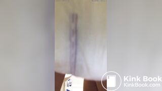 Girl pooping in her diaper.