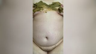 SSBBW smears her green shit on her big belly and tits