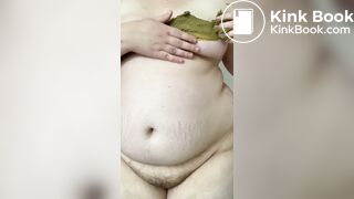 SSBBW smears her green shit on her big belly and tits