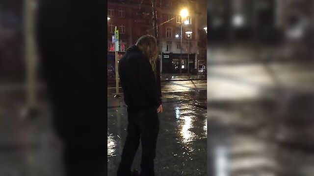 guy pissing in the rain