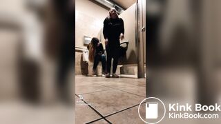 Blonde girl pooping while accompanied by friend