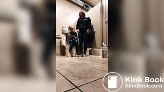 Blonde girl pooping while accompanied by friend