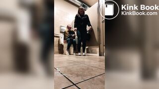 Blonde girl pooping while accompanied by friend