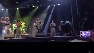 singer pisses on fan on stage.